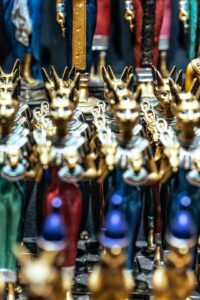 a group of brass figurines sitting next to each other