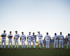 lined baseball players on field