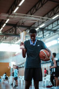 a person holding a basketball