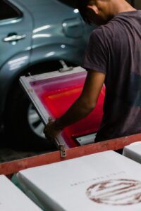 man holding silk screen